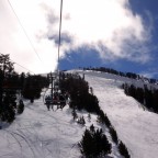 Heading up the chairlift La Botella with some clouds in the sky