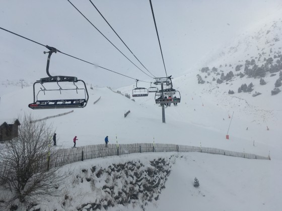 Heading up Les Fonts chairlift under the snowfall