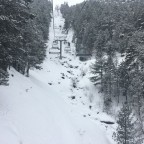 The river is totally frozen under the chairlift Josep Serra