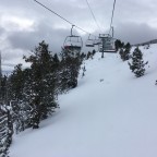 Heading up the chairlift La Botella with an untouched powder view