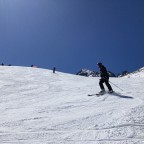 Skiing down Els Orris green run