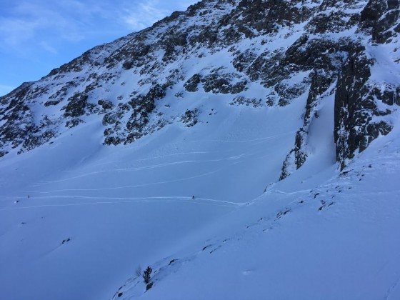 Some skiers making lines on the off-piste of Arcalís