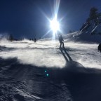 Skiers on Coll de la Botella blue slope