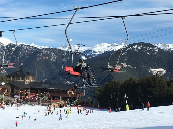 This skier was too excited to wait until the end of the chairlift
