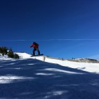 Instructor jumping on the off-piste of Pal